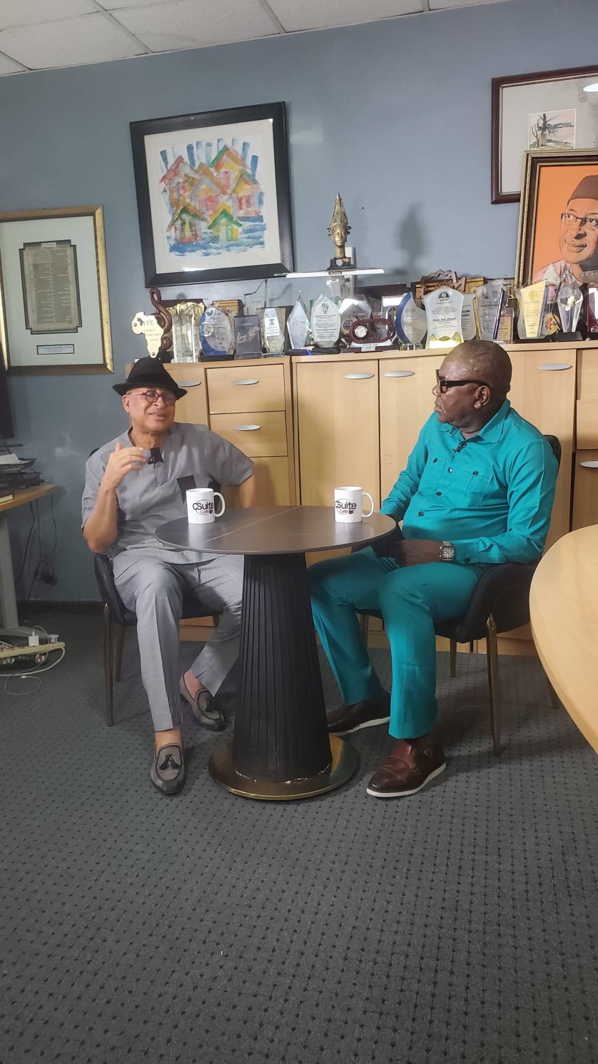 Pat Utomi and my humble self on the set of C-Suite Café
Watch out for the explosive snippets, then...