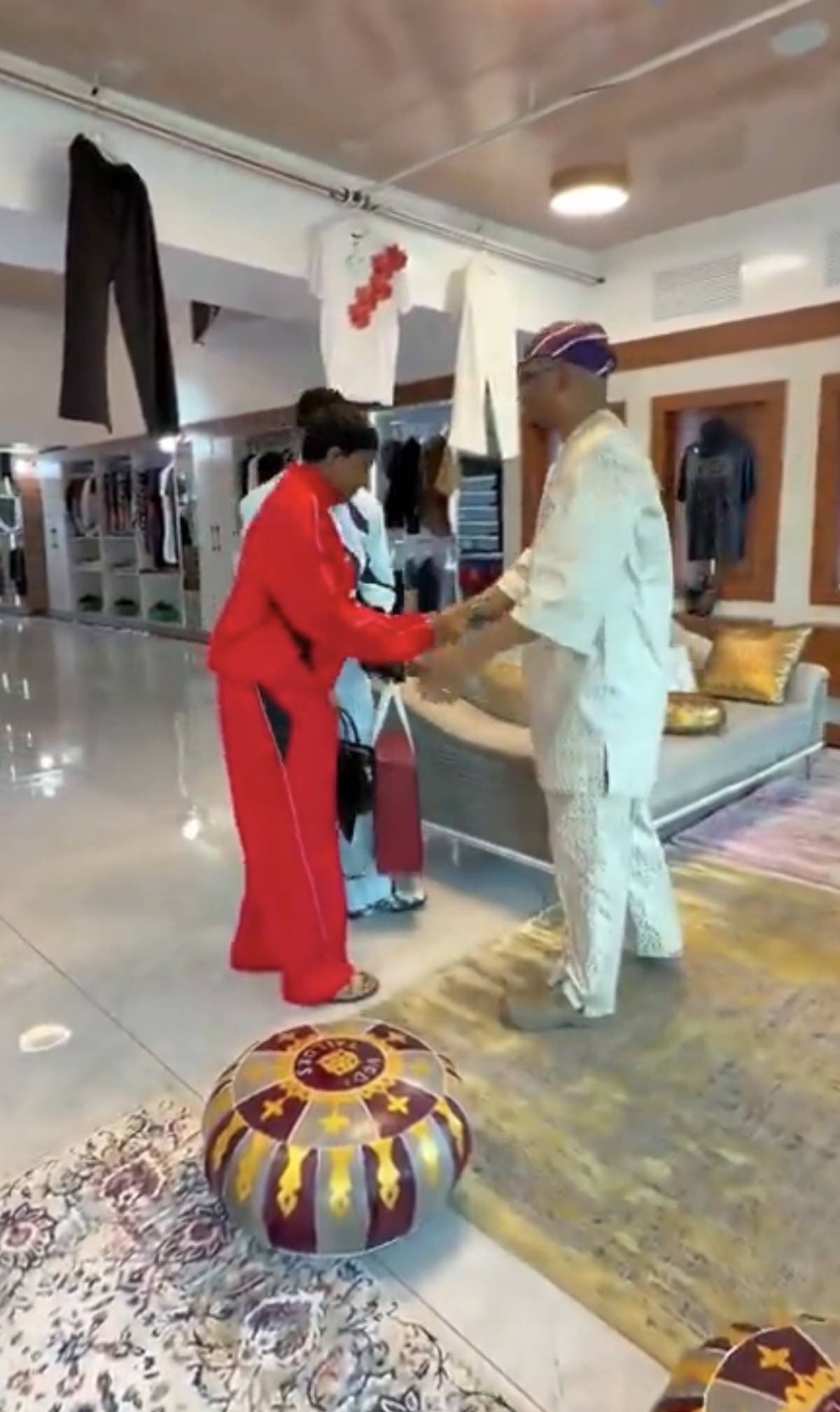 Peller and Jarvis paid Seyi Vodi a visit to personally deliver their wedding aso ebi, but the conver...