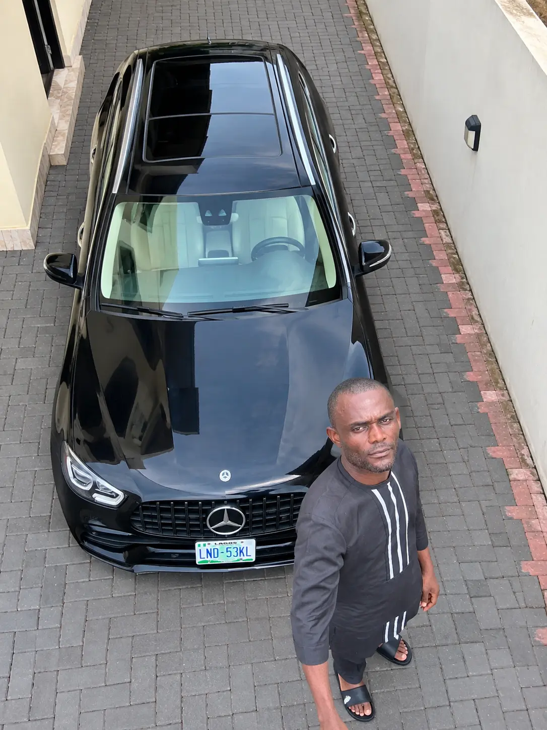 Behind every successful man is a black Benz