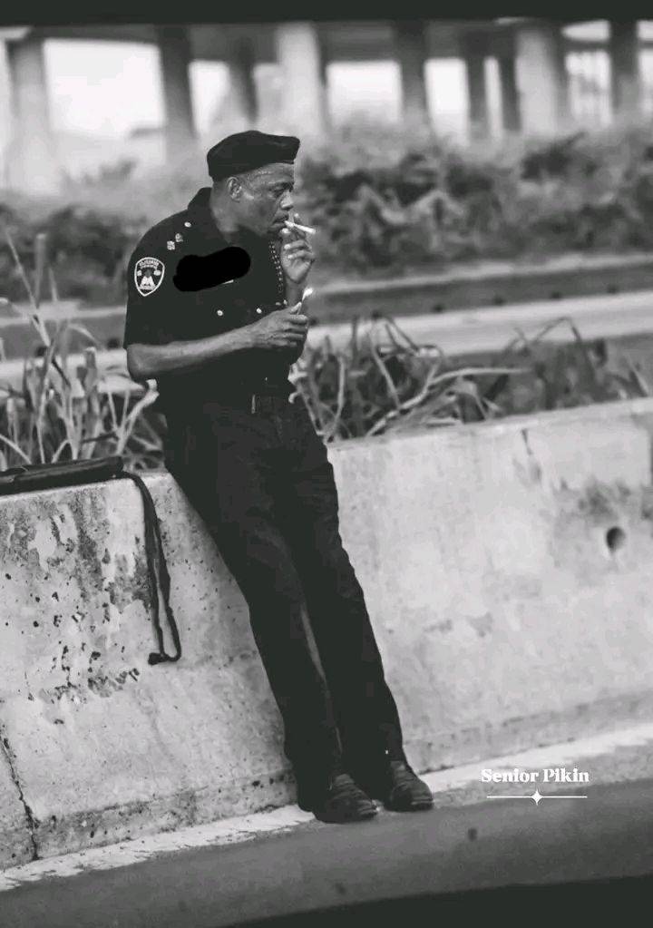 Nigerians react to a police officer in uniform captured on camera sm0k!ng on duty on a highway. Can'...