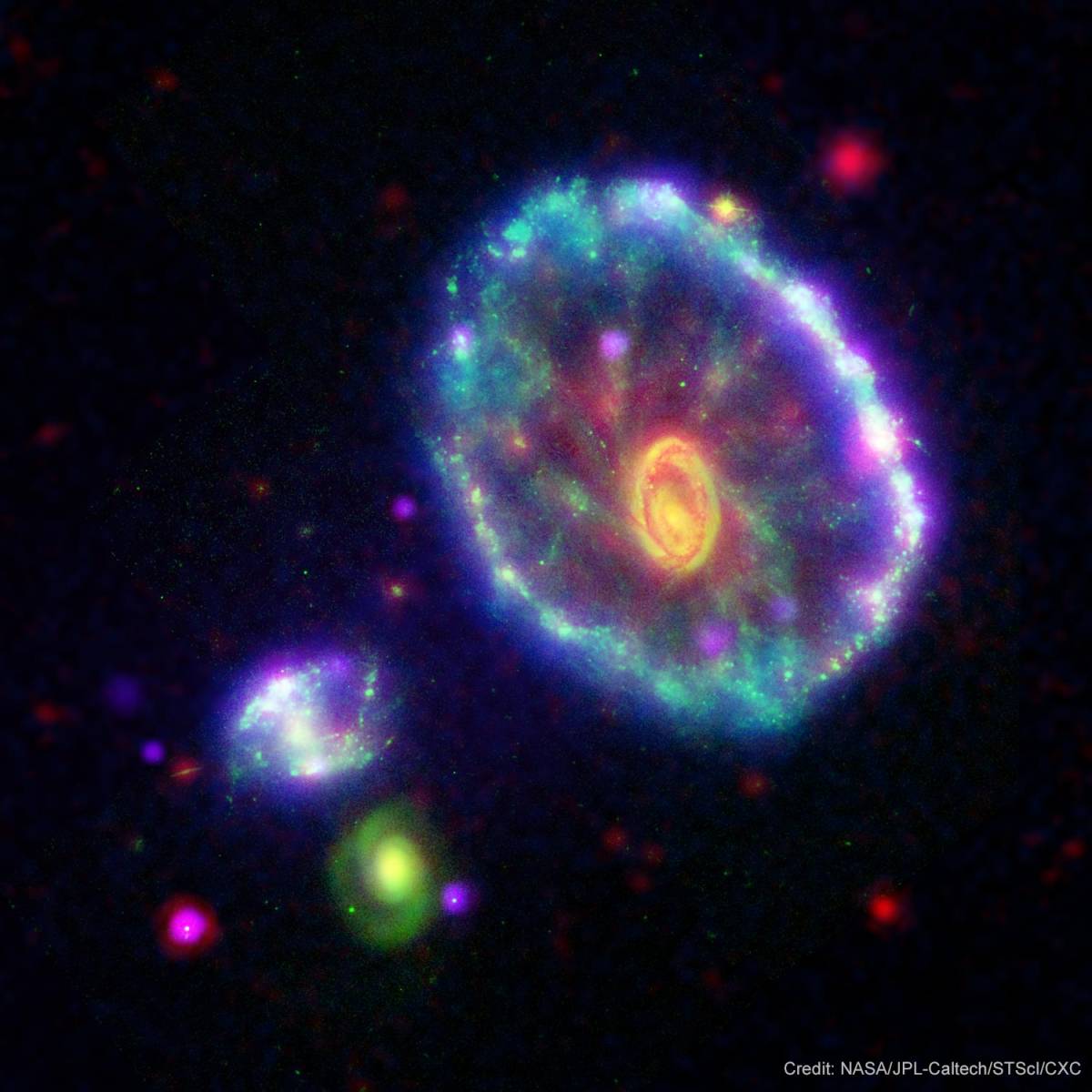 By the time you read this, the expanding universe will carry the Cartwheel galaxy another 56,000 mil...