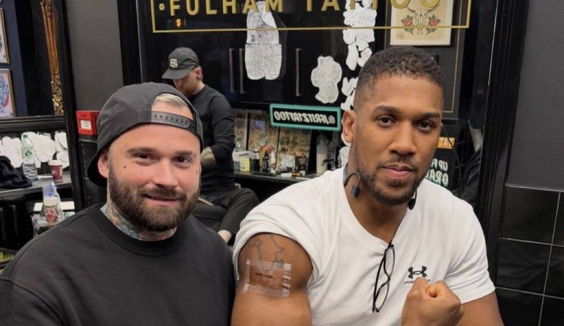 Anthony Joshua pays tribute to late friends Kevin Ayodele and Sina Ghami with fresh tattoos after th...