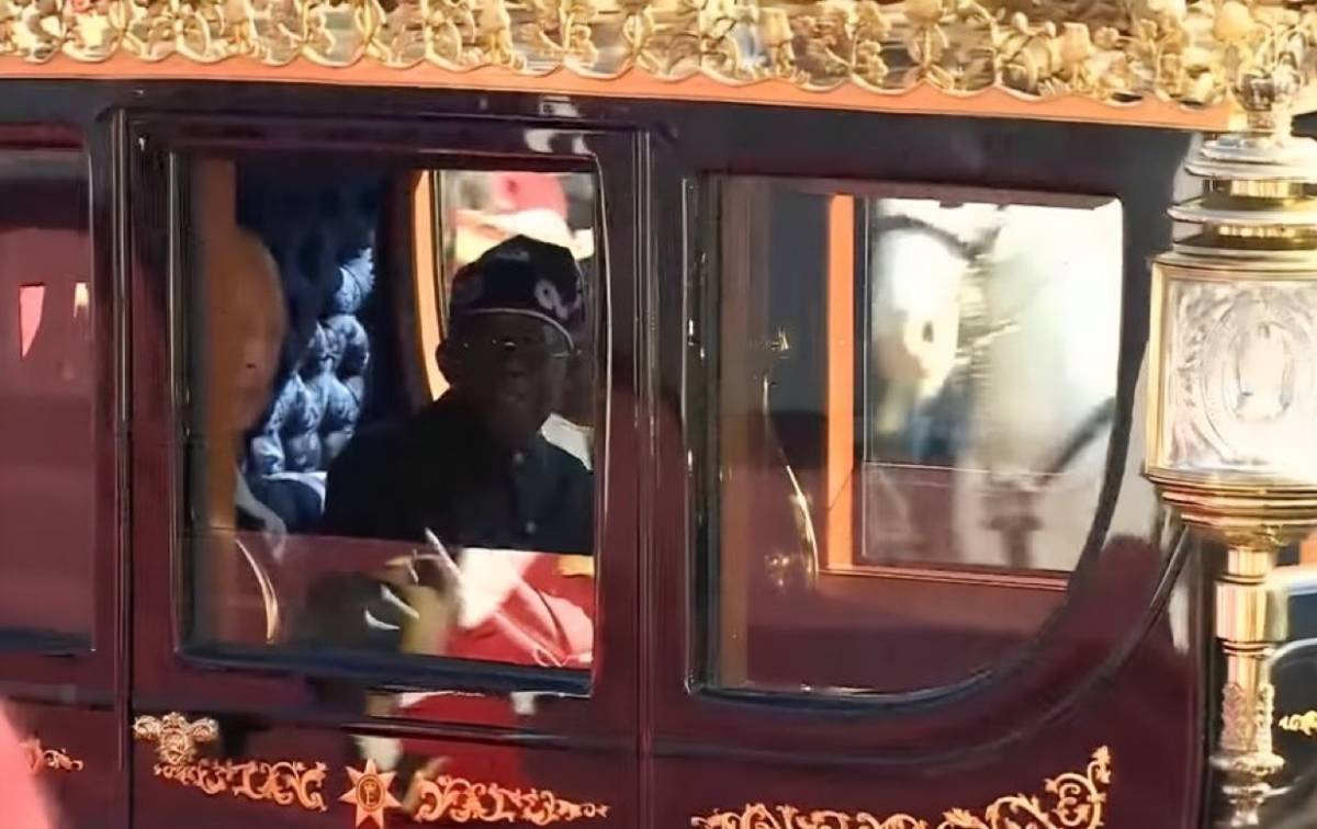 President Bola Tinubu and Britain's King Charles III (obscured) travelled in the Australian State Co...