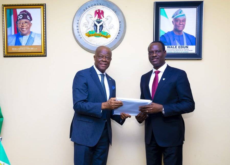 Wale Edun and Taiwo Oyedele, during the formal handover of responsibilities at the Federal Ministry...