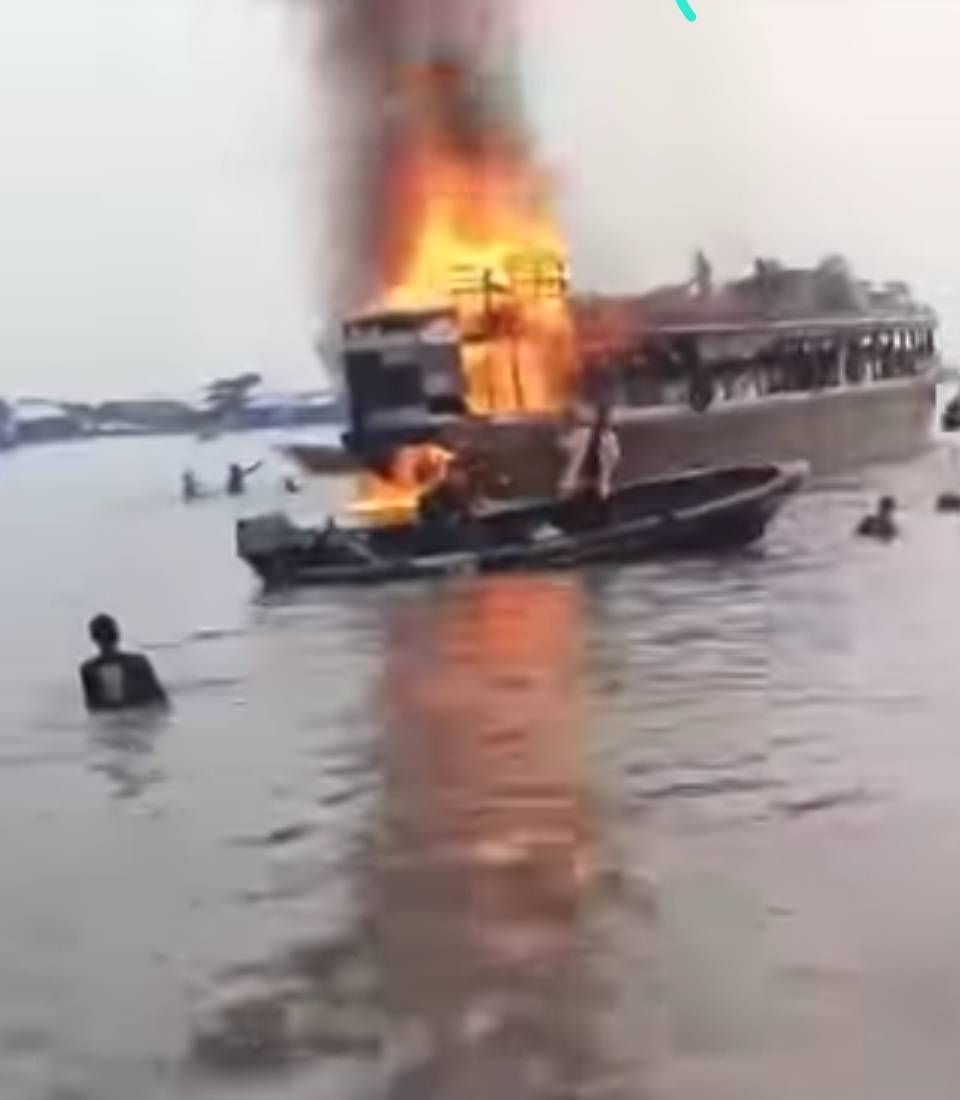 On the Ramos River in Agge Community, Ekeremor LGA, Bayelsa State, a local wooden boat carrying good...