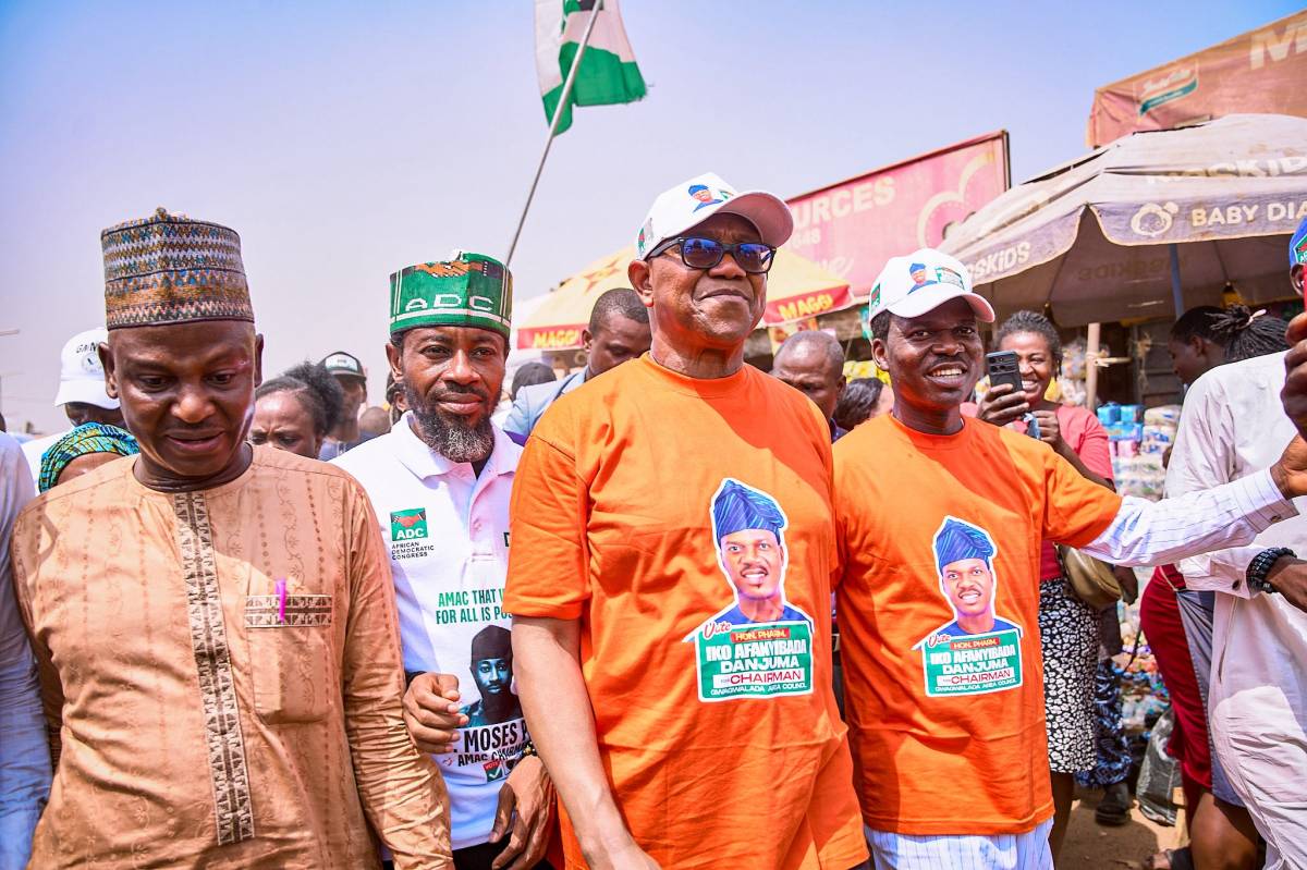 Look at Peter Obi wearing the campaign polo of an ADC chairmanship candidate, walking through the ma...