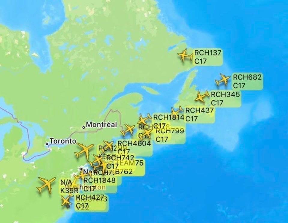 A large formation of US Air Force C-17 transport planes is crossing the Atlantic en route to the Mid...