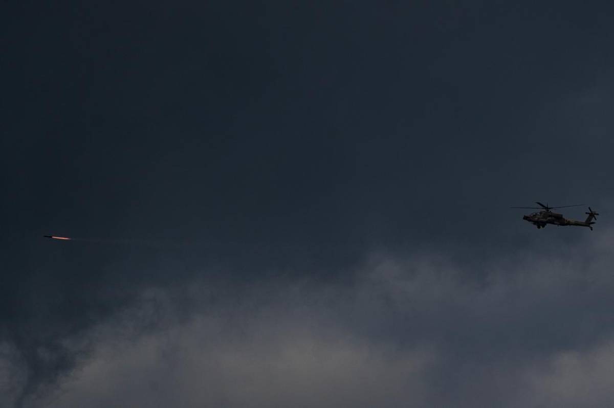 Israeli military helicopter seen launching a missile as Israel strikes Hezbollah in Lebanon.
Photos...
