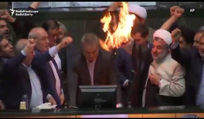 In Iranian Parliament, MPs burn the American flag while chanting “Death to America,” and threaten to...