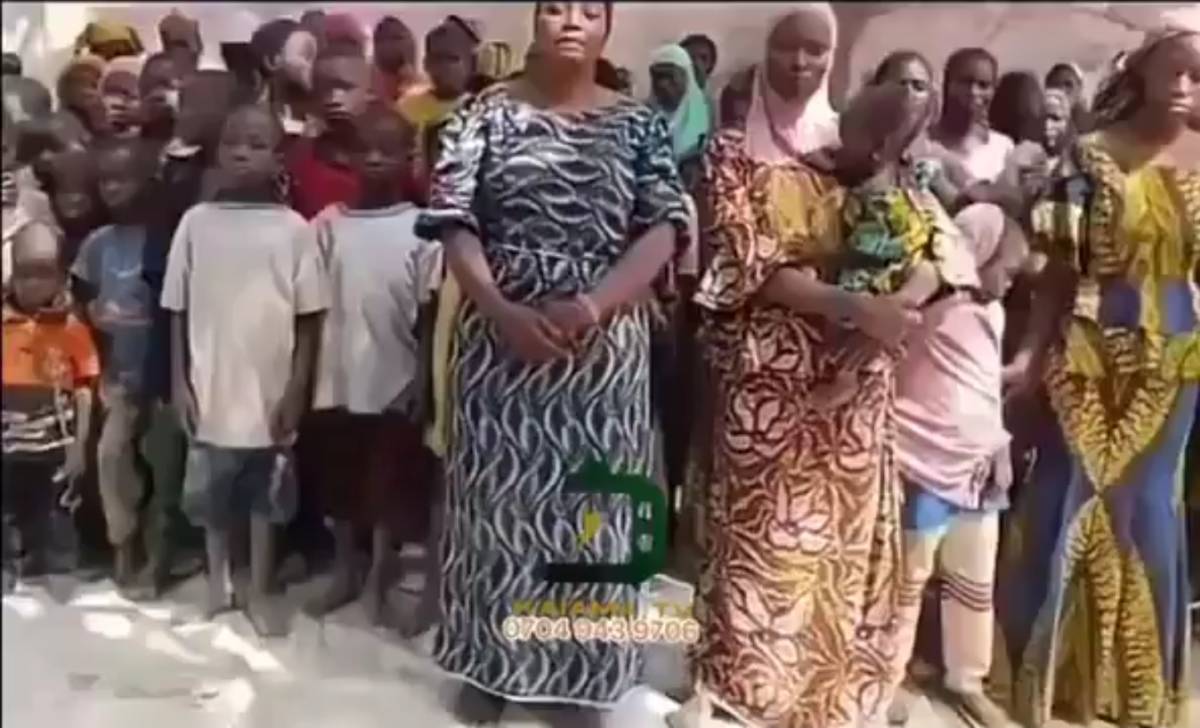 Boko Haram Parades Over 100 Abducted Victims from Kwara Community, Accuses Tinubu's Government Of Pr...
