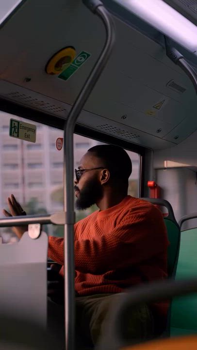 A commercial advertisement for NEV Electric Limited, a Nigerian manufacturer of electric buses.