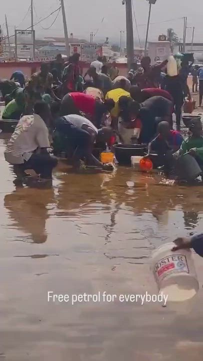 Residents seen scooping fuel after tanker falls in their community amid rising fuel prices
