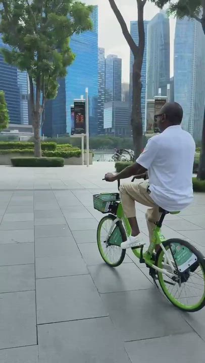 Billionaire businessman Femi Otedola enjoying himself in Singapore as he rides a bicycle