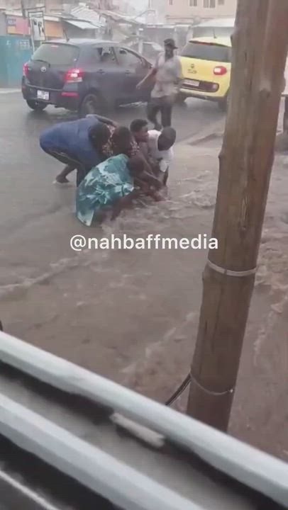 Video of the Moment heavy rainfall swept a man away in Ikotun Market, Lagos State, as other traders...