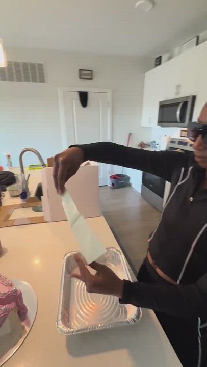 Lady celebrates her divorce in style as she burns her marriage certificate and throws herself a cake...