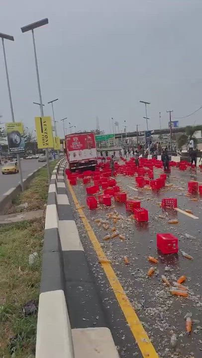 Truck transporting crates of soft drinks spilled its contents along Ikoyi Road, scattering dozens of...