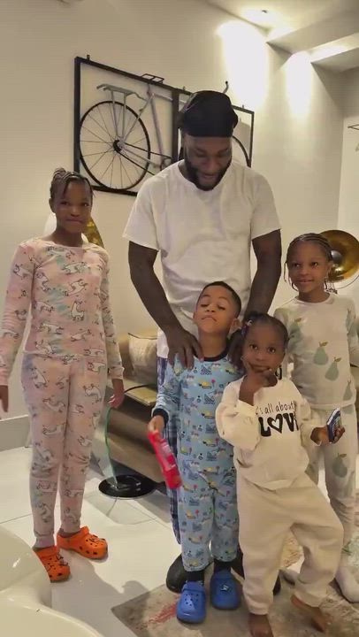 Nigerian Singer Burna boy makes kids’ day as he allows them to play inside his luxury cars.