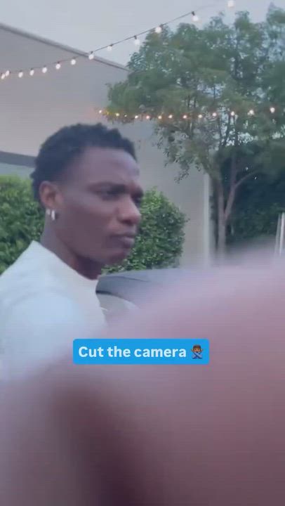 Wizkid doesn’t like camera’s in his space, hits camera
