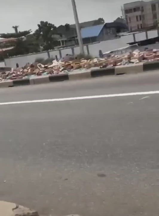 A loaded truck was captured spilling it's contents on the road
