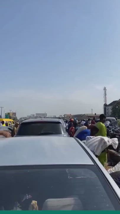 "We are going to work, and we have been stuck here because people are praying on the road."

-Lady l...