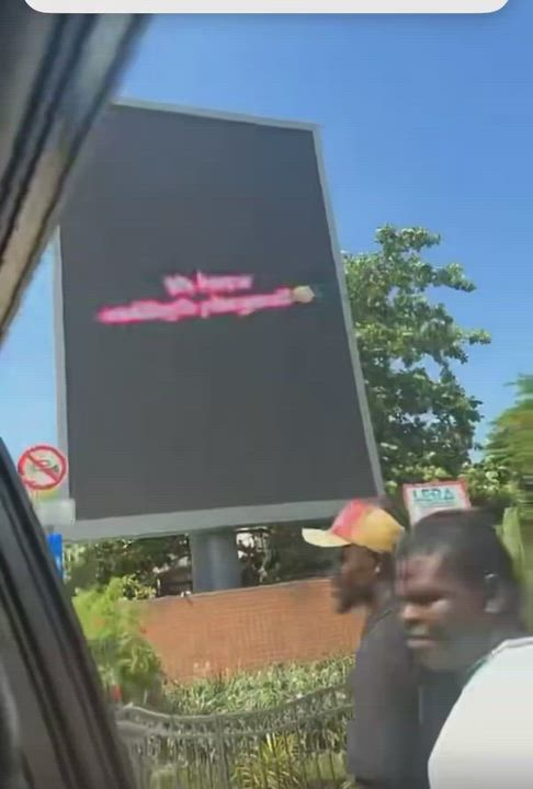 Jarvis’ reaction after Peller surprised her with a billboard display from their proposal in Ghana.