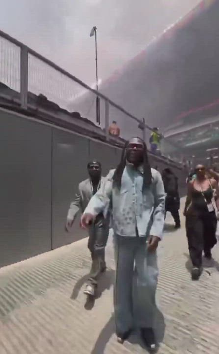 Burna Boy leaving the stadium after a successful performance with Shakira at the World Cup opening c...