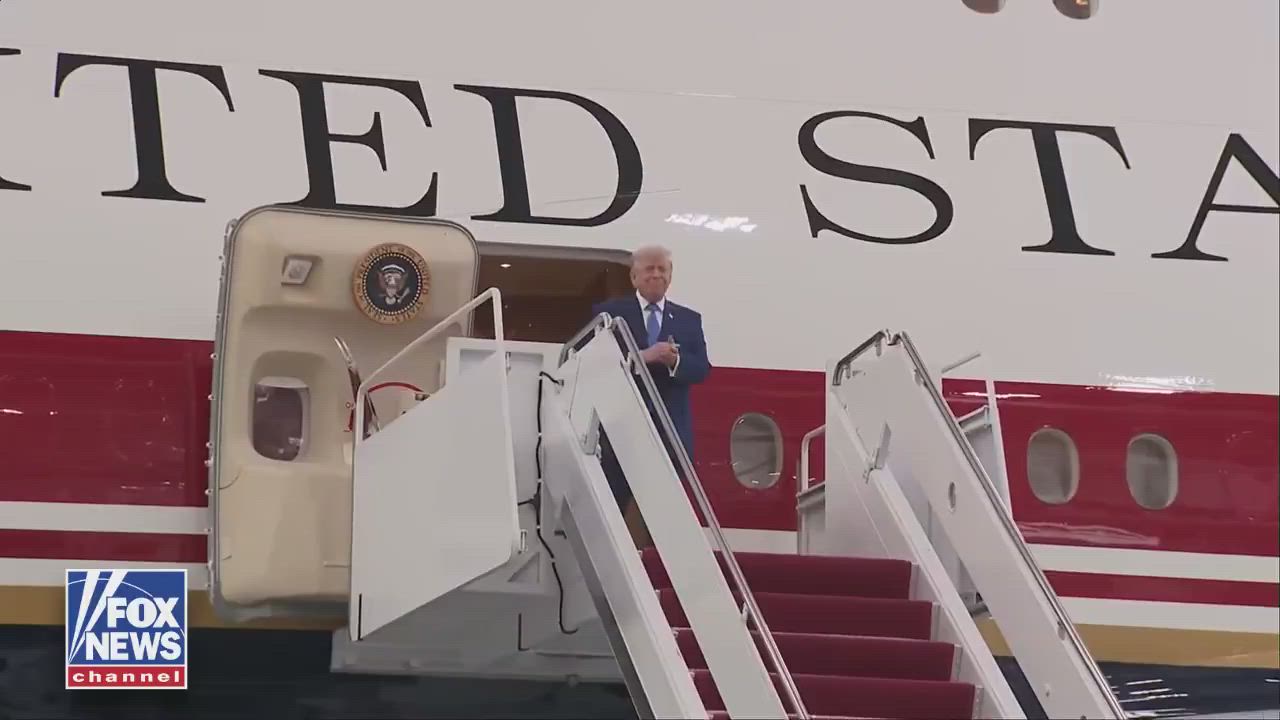 President Trump steps off the new Air Force One and is immediately greeted by service members at Joi...