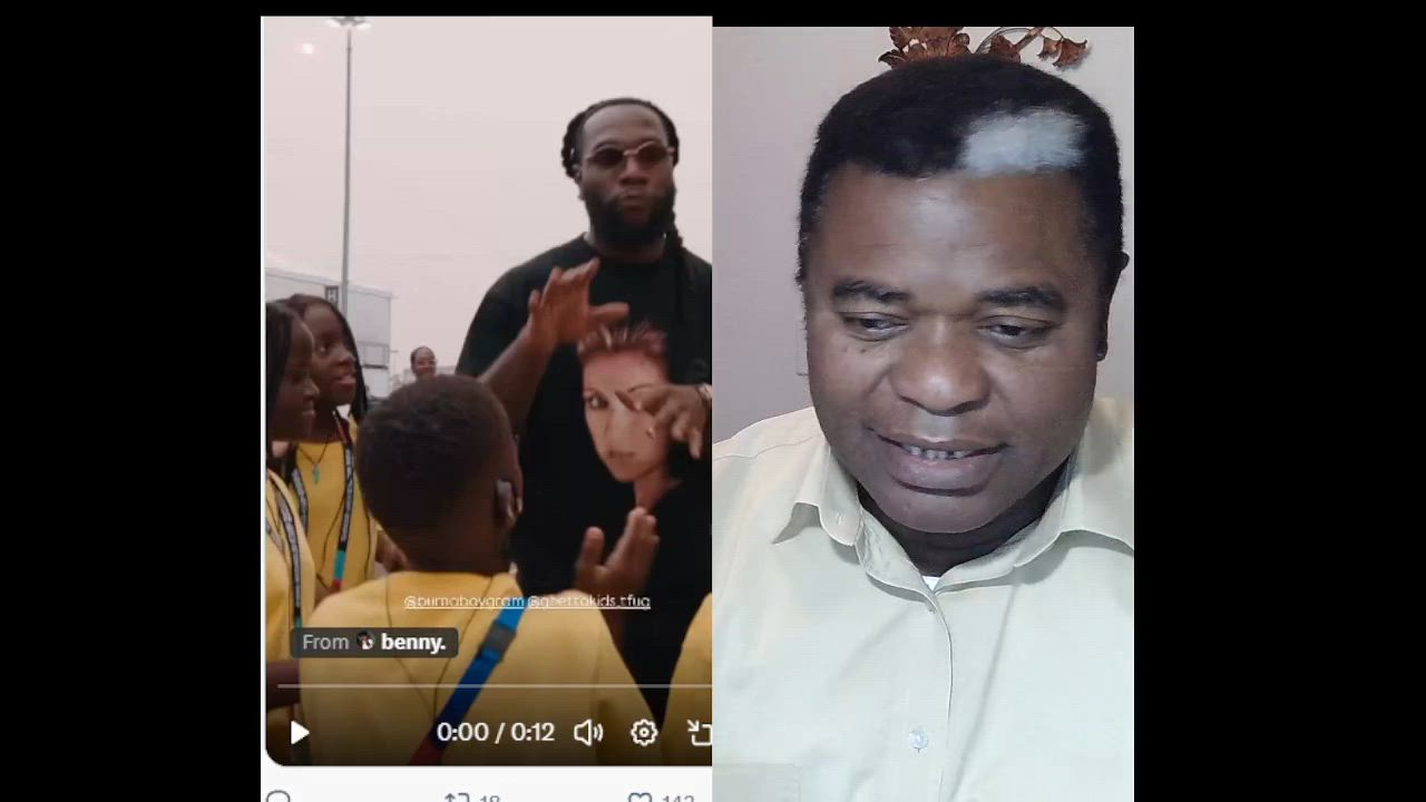 Burna Boy with the ghetto kids and acted like a proper Naija boy.