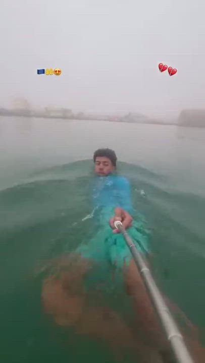 Moroccan migrant filming himself with a selfie stick while swimming into the Spanish enclave of Ceut...